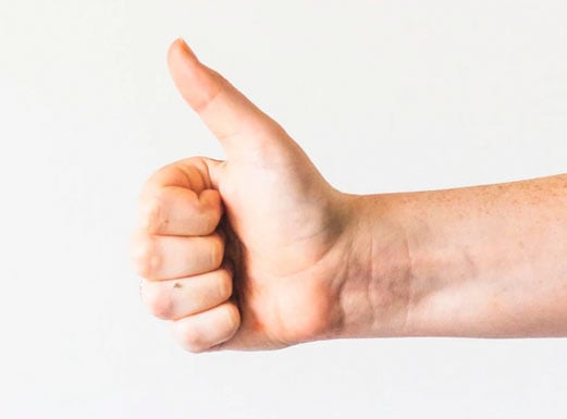 A hand giving a thumbs up.