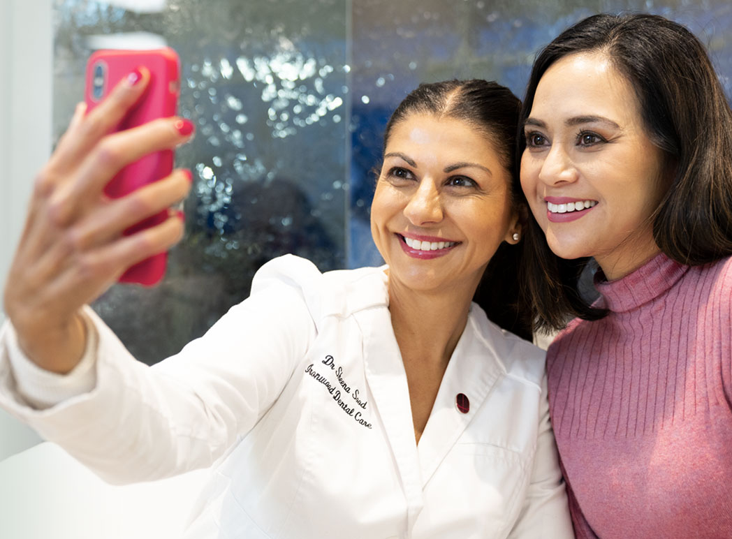 Dr Sheena Sood taking a selfie with a patient who is showing her new Digital Smile Design smile.