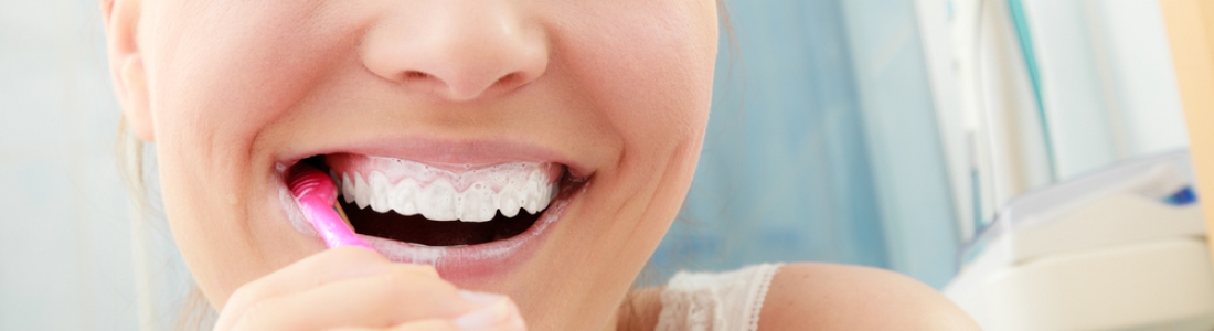 woman brushing her teeth